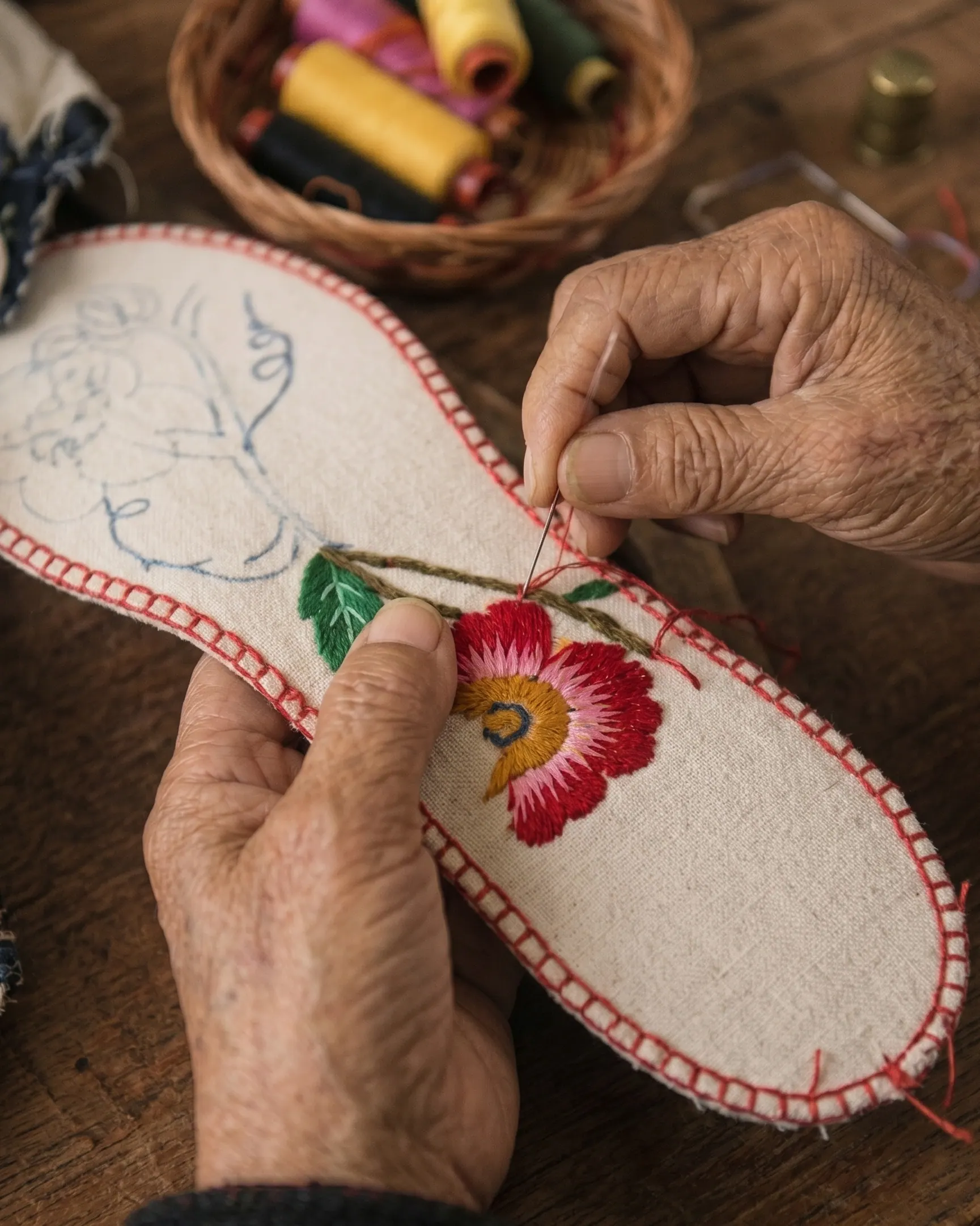 Thread, cloth, and handwork connected to Yuan-Yi Art's brand story