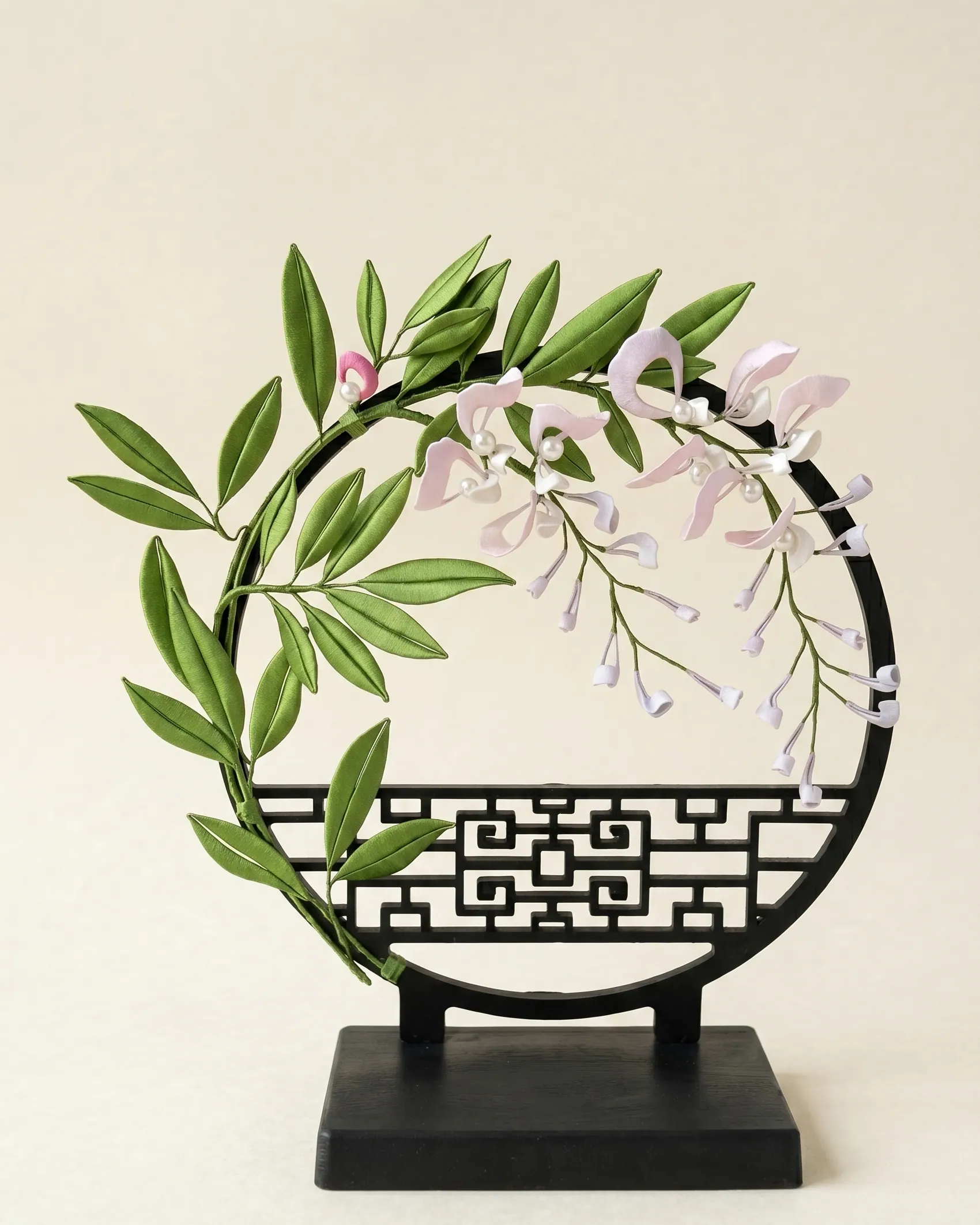 Orchid motif in pink silk-wrapped chanhua — symbol of purity and grace