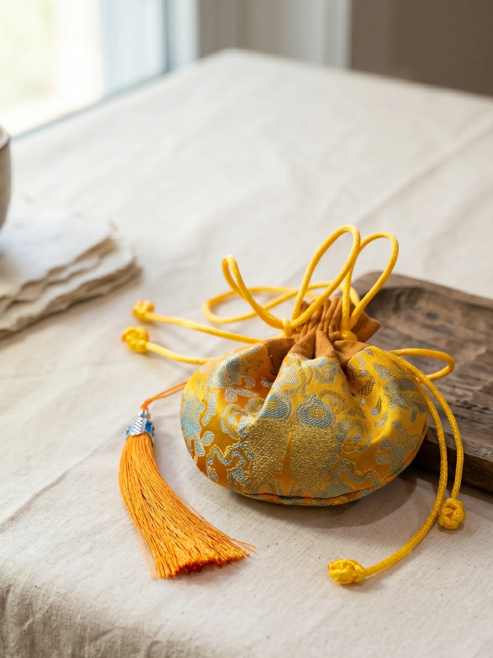 Embroidered herbal sachets arranged together